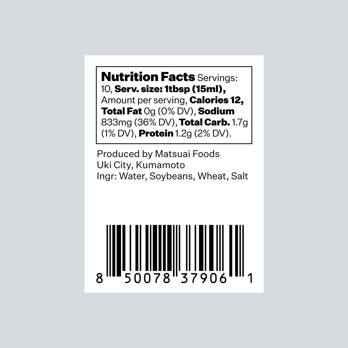 A Nutrition Facts label on a white rectangular card, showing text including 'Nutrition Facts', serving size, calories, total fat, sodium, total carbs, and protein, plus a barcode and production details for Matsui Foods. The card is centered on a light gray background.