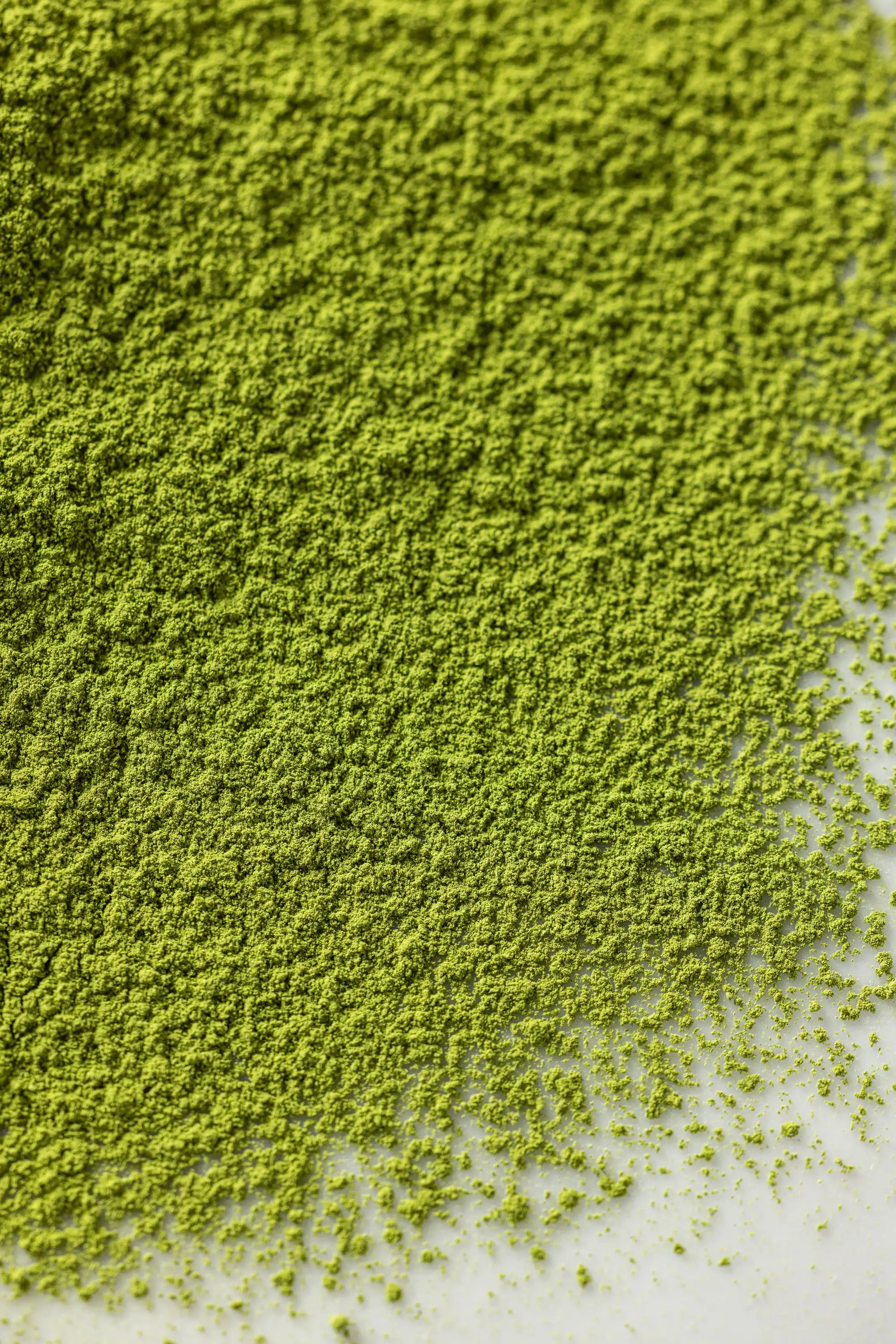Close-up of green Oyama Seicha matcha powder on a white surface