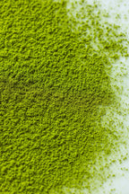 Close-up of Honyama matcha powder on a white surface