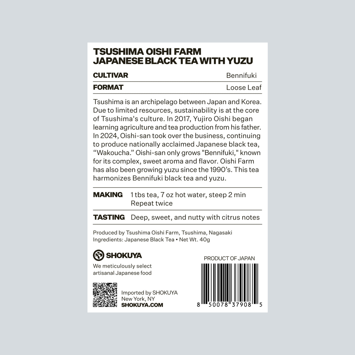 The back of a Shokuya TSUSHIMA OISHI FARM JAPANESE BLACK TEA WITH YUZU package, showing product details, cultivation, format, making, tasting notes, ingredients, a QR code, and a barcode on a white background.