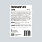 The back of a Shokuya TSUSHIMA OISHI FARM JAPANESE BLACK TEA package, showing product details, cultivation, format, making, tasting notes, ingredients, a QR code, and a barcode on a white background.