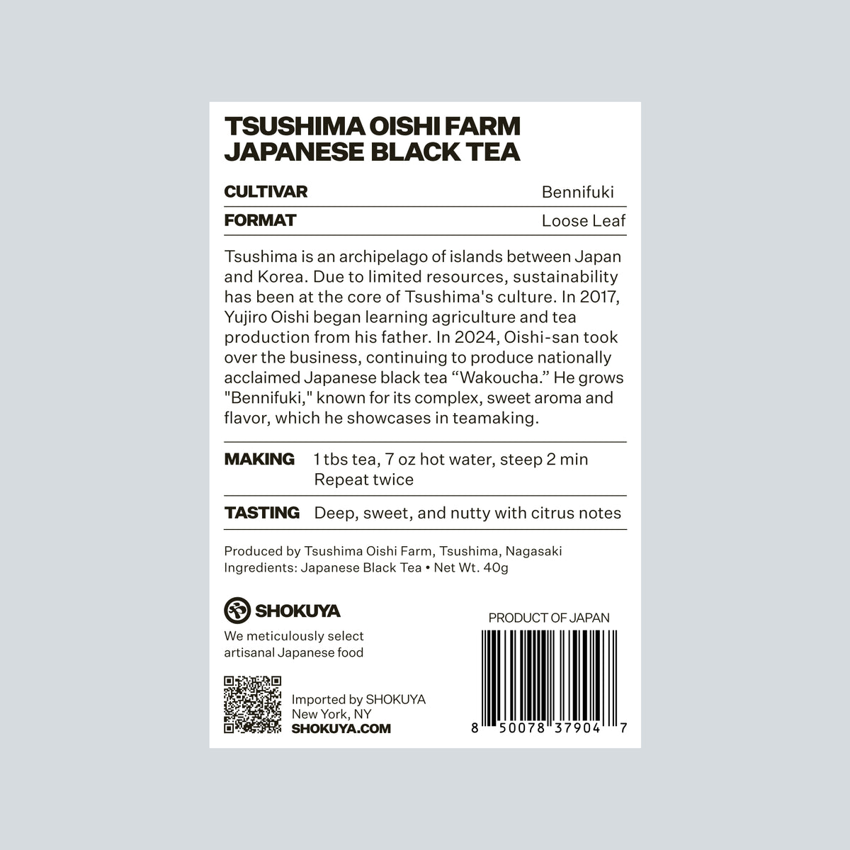 The back of a Shokuya TSUSHIMA OISHI FARM JAPANESE BLACK TEA package, showing product details, cultivation, format, making, tasting notes, ingredients, a QR code, and a barcode on a white background.