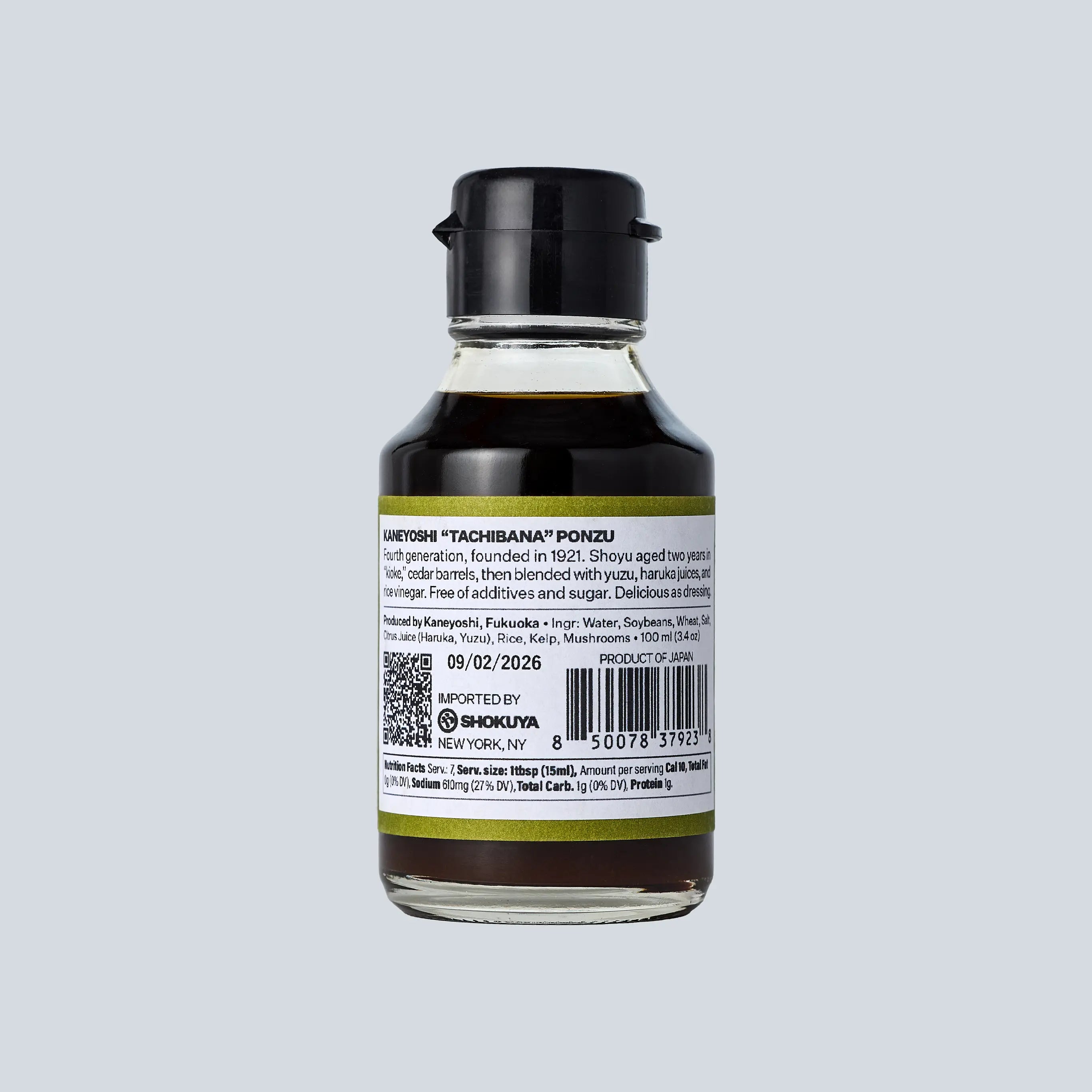 Bottle of Ponzu sauce with label on a light gray background