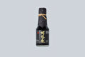 Bottle of Matsuai 10-Year-Aged Soy Sauce with a textured label on a light gray background. 