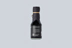 Bottle of Matsuai 10-Year-Aged Soy Sauce with a textured label on a light gray background. 
