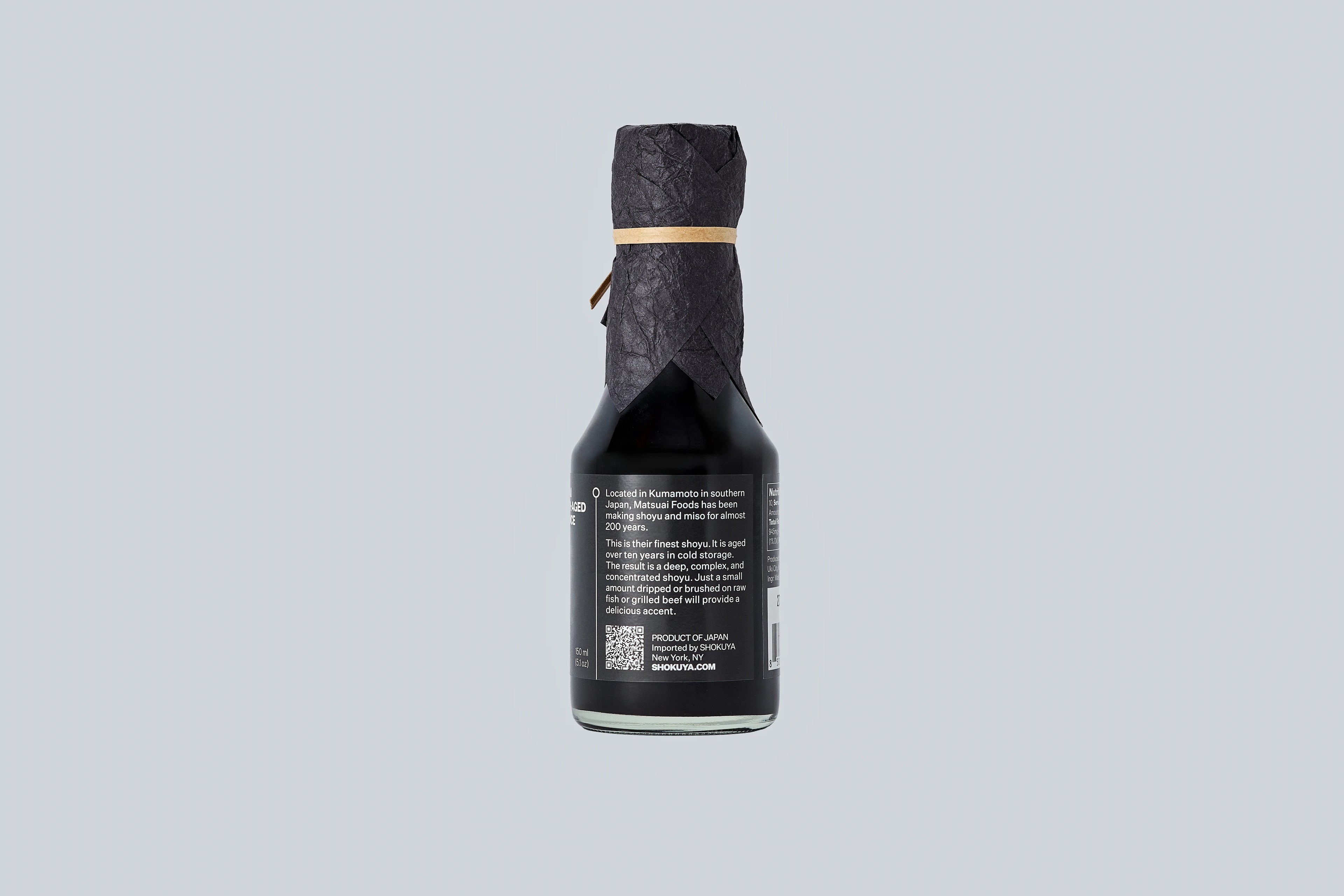 Bottle of Matsuai 10-Year-Aged Soy Sauce with a textured label on a light gray background. 