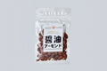 Clear bag of Matsuai Shoyu Roasted Almonds with white label on the front on light gray background