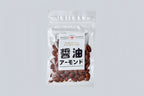 Clear bag of Matsuai Shoyu Roasted Almonds with white label on the front on light gray background