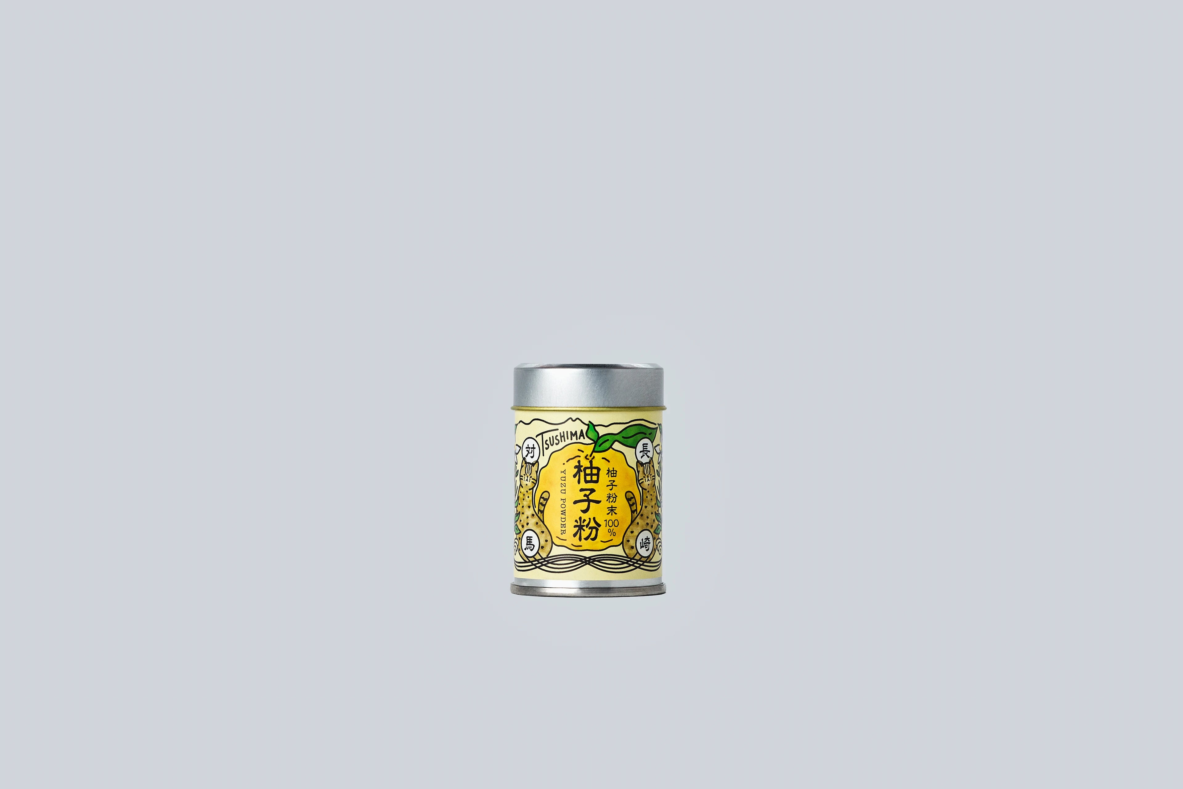 Small metal canister of Japanese yuzu powder from Oishi Farm centered on a light gray background, with a yellow illustrated label showing yuzu fruit and Japanese text.